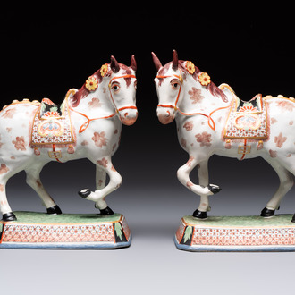A pair of polychrome and gilt-decorated Dutch Delft petit feu horses, 18th C.