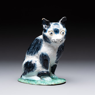 A fine polychrome Brussels faience model of a cat, 18th C.