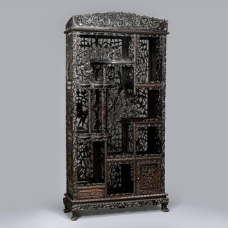 A richly carved Chinese hongmu display cabinet, Canton, 19th C.