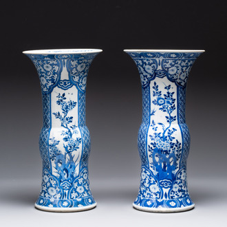 A pair of Chinese blue and white 'gu' vases with floral design, Kangxi