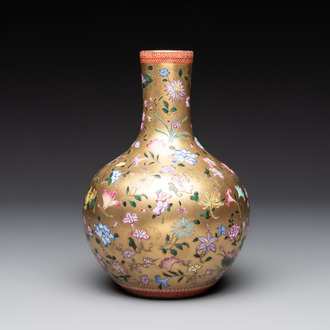 A Chinese gilt-ground famille rose vase with floral design, Qianlong mark and possibly of the period