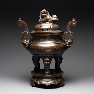A massive Vietnamese copper- and silver-inlaid 'Buddhist lion' censer and cover on stand, 19th C.