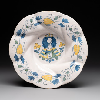 A polychrome Dutch Delft twisted 'Queen Mary' dish, erroneously inscribed K N, 17th C.