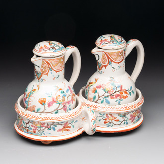 A rare polychrome Dutch Delft petit feu cruet set of two jugs and covers on a stand, 18th C.