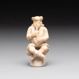 A carved alabaster figure of a seated bagpiper, Low Countries, possibly 17th C.