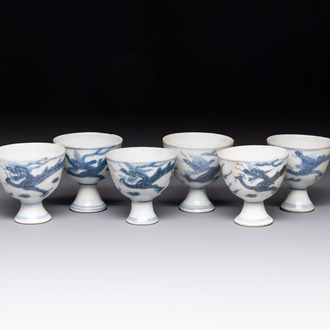 Six Chinese blue and white 'Hatcher cargo' stem cups with dragons, Transitional period