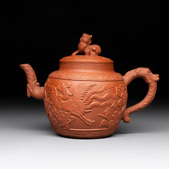 A Chinese Yixing stoneware 'phoenixes and peonies' teapot and cover, Kangxi
