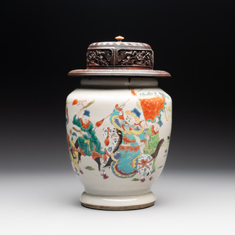 A Chinese famille rose 'warrior on horseback' vase and a wooden cover, Yongzheng/Qianlong