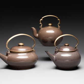 Three Chinese Thai market polished Yixing stoneware teapots with brass mounts, 19th C.