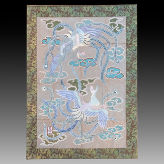 A Japanese embroidered wool and silk wall tapestry with two phoenixes, Meiji, 19th C.