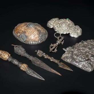 Four Tibetan bronze and wooden phurbas, a 'kapala' or skull-bowl and two silver ornaments, 19th C.
