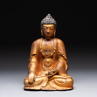 A Chinese gilt-lacquered wooden sculpture of Buddha, Ming