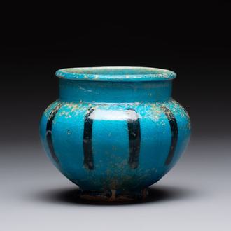 A fine Raqqa turquoise-glazed striped jar, Syria, 13th C.
