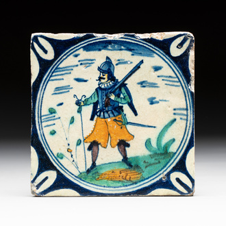 A polychrome Dutch Delft maiolica 'soldier' medallion tile, late 16th C.