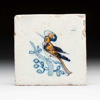 A polychrome Dutch Delft 'bird on a branch' tile, 17th C.