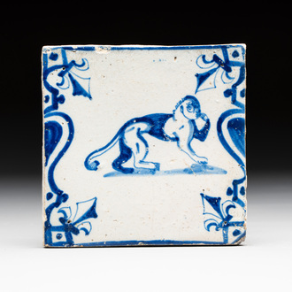 A blue and white Dutch Delft 'monkey with human face' 'candelabra' tile, 17th C.