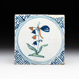A polychrome Dutch Delft 'butterfly on a campanula' tile, 17th C.