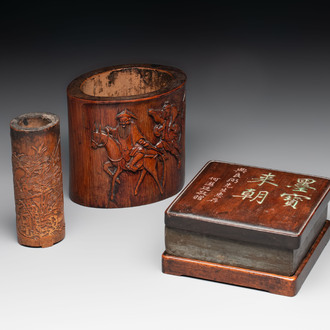 Two Chinese carved bamboo brush pots and an ink stone with wooden cover and stand, signed He Xuanting 何選廷 and Dian Liangbi 典良弼, 19th C.