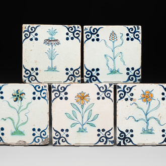 Five polychrome Dutch Delft 'flower' tiles, 17th C.