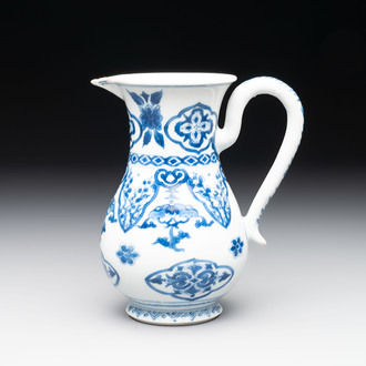 A Chinese blue and white jug with floral design, Kangxi