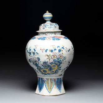 A large polychrome Dutch Delft baluster vase and cover, late 17th C.
