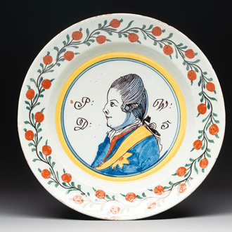 A polychrome Dutch Delft 'orangist' 'royal portrait' plate, 18th C.