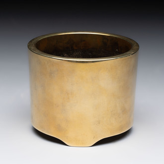 A Chinese bronze cylindrical tripod censer, Xuande mark, 18th C.