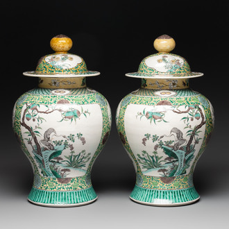 A pair of Chinese verte-biscuit 'cranes and flowers' vases and covers, 19th C.