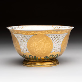 A Chinese European-decorated gilt bronze-mounted blue and white reticulated bowl, Transitional period