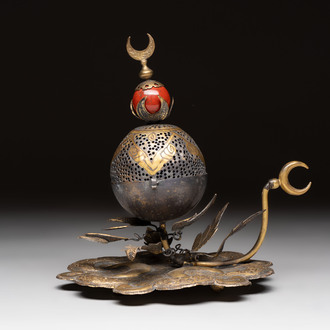 An Ottoman gilt-bronze inscribed incense burner with a red stone, 19th C.