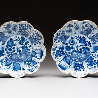 A pair of Chinese blue and white lotus-form 'grasshopper' plates, Kangxi