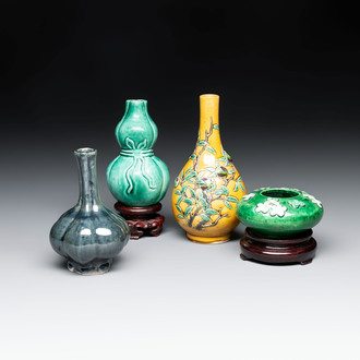 Four Chinese monochrome wares and two wooden stands, 19th C.