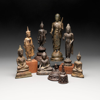A varied collection of eight bronze Buddha figures, South Asia, 18/19th C.
