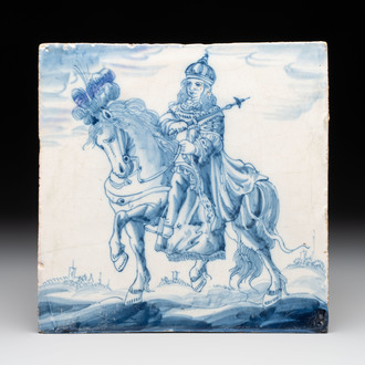A rare and large blue and white Dutch Delft 'sovereign on horseback' tile, first half 17th C.