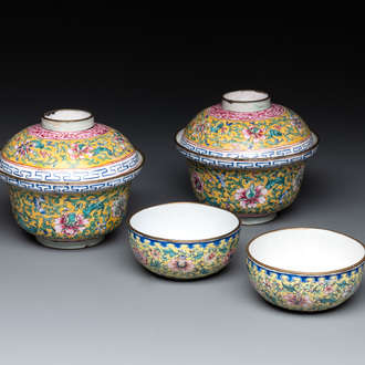 A pair of Chinese yellow-ground Canton enamel covered bowls and two cups, Yongzheng/Qianlong