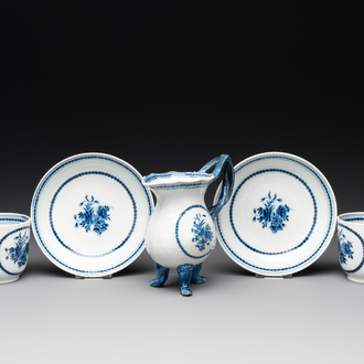 A pair of Chinese blue and white handled cups and saucers and a milk jug, Qianlong/Jiaqing