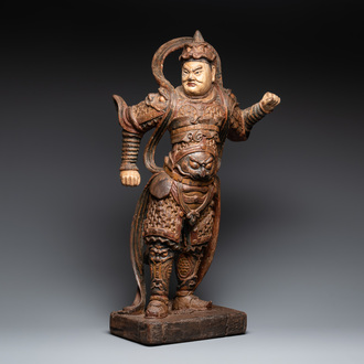 A large Chinese polychrome-lacquered wooden figure of a Guardian King, 18/19th C.