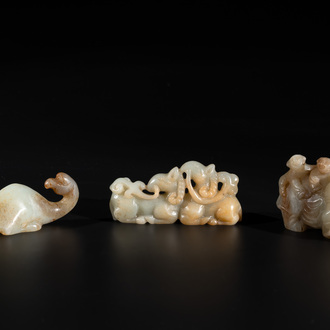 Three Chinese celadon and russet jade carvings of animals, 19th C.