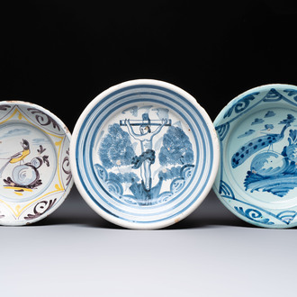 A polychrome maiolica dish and two blue and white dishes, Northern Netherlands, 17/18th C.