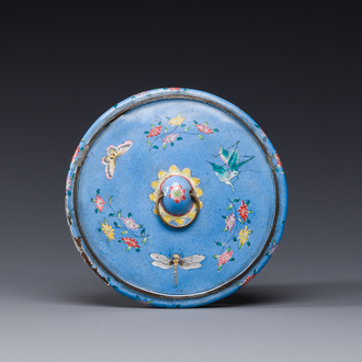 A Chinese Canton enamel blue-ground circular hand mirror, early 19th C.