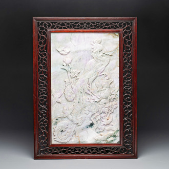 A Chinese lavender and green jadeite 'phoenix' plaque in a hongmu frame, early 20th C.