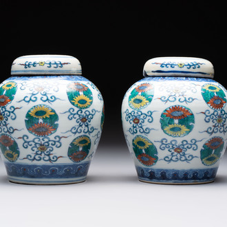A pair of Chinese doucai 'chrysanthemum' jars and covers, Daoguang mark and of the period