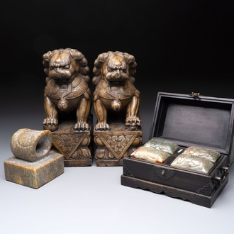 A pair of Chinese carved stone Buddhist lions, a large seal and a wooden box with four seals, 20th C.