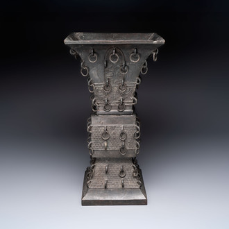 A large Chinese bronze quadrangular 'gu' vase with hanging rings, Ming