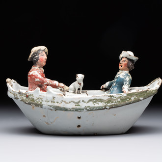 A cold-painted white Dutch Delft 'rowing boat' group, 18th C.
