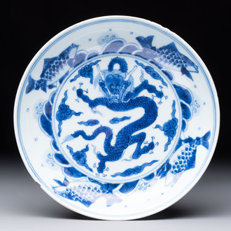 A Chinese blue and white 'dragon and carps' plate, Yongzheng mark and of the period