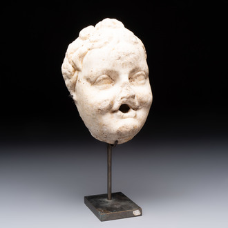 A marble 'putto head' fountain spout, France or Italy, 19th C. or earlier