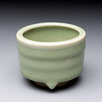 A small Chinese Longquan celadon cylindrical tripod censer, Ming