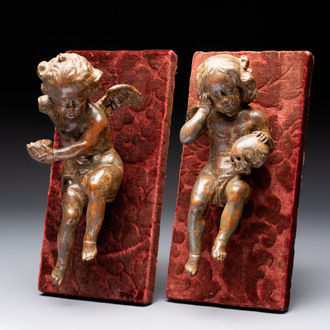 A pair of Flemish allegorical carved wood cherubs, 17th C.