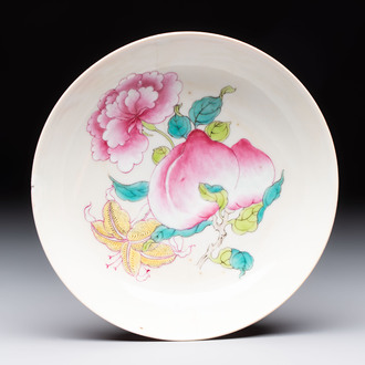 A Chinese famille rose ruby-back saucer dish with peaches and flowers, 18th C.